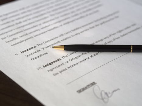 Close-up image of a business contract and pen, signed and ready for agreement.